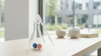 A sealed glass syringe and a pressure gauge on a clean lab bench
